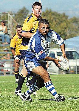 New Moree Boars hooker Allan McKenzie unloads during the West Knockout win against Coonabarabran. Unicorns prop Andrew Wilkes looks on. Turn to pages 98/99 for more on the start of the Group 4 season. Photo: Geoff O’Neill