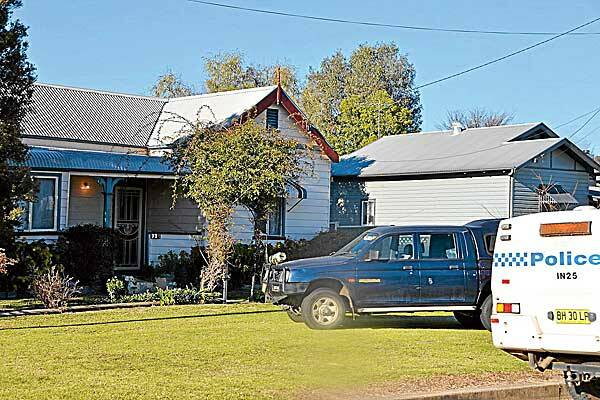 keeping watch: A Granville Street, Inverell, home was under police guard yesterday after a drug lab was found in the back shed. Photo: Steve Green, The Inverell Times
