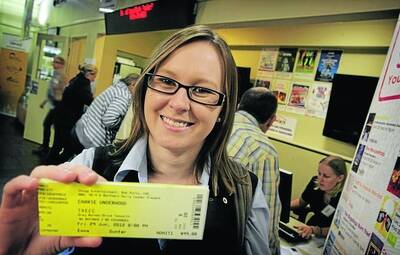 POPULAR CONCERT: Emma Gunter from Tamworth with five Carrie Underwood tickets, bought yesterday at theTamworth Visitor Information Centre. Photo: Kitty Hill 140512KHA02