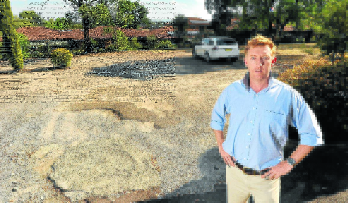 BUYER BEWARE: Calrossy Anglican School business manager Hugh Castleden is urging other businesses to be vigilant after a conman cold-called the office offering cheap deals in return for bitumen work. Photo: Gareth Gardner 210114GGE01