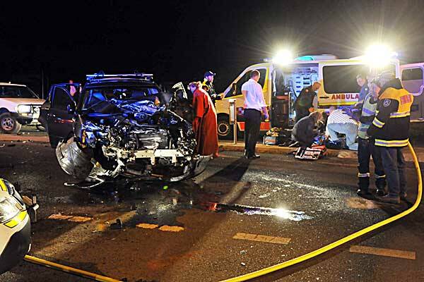 ALL UNITS: Paramedics, police and fire brigade units all rushed to a collision between a car and utility at the roundabout at the intersection of Nundle Rd, O’Briens Ln and Back Kootingal Rd yesterday evening. Photo: Barry Smith 190712BSD06