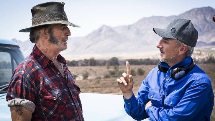 John Jarratt with director Greg McLean on the set of <i>Wolf Creek 2</i> in South Australia. Photo: Mark Rogers