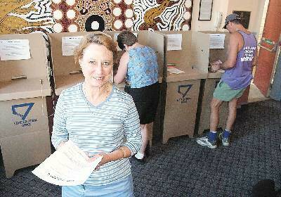 No hitches: Lynette Schuh, returning officer for the Armidale Dumaresq Council watches voting in progress in the Armidale Town Hall on Saturday morning.