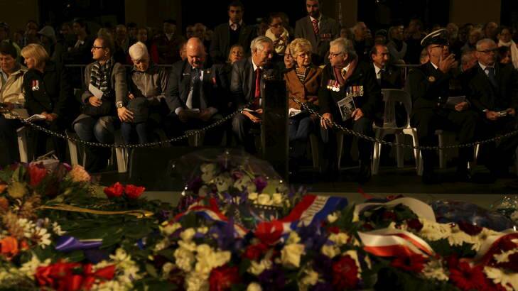 Veterans and their families at the Martin Place war memorial during the ANZAC day dawn service. Photo: Kate Geraghty