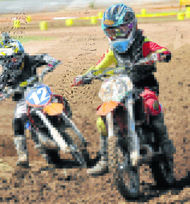 Rex Bates (left) and Ryan Vallance made short work of the track in the 65cc class during Tamworth s first Stadium Cross. Photo: Geoff O Neill 071213GOG05