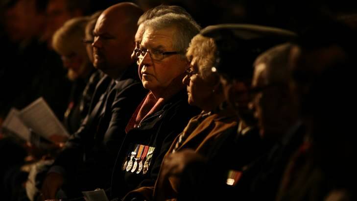 Vietnam veteran Bill Humphreys (centre) during the Anzac dawn service at the Martin Place war memorial. Photo: Kate Geraghty