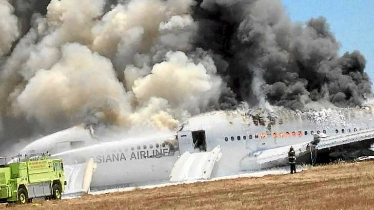 Asiana Airlines Boeing 777 is engulfed on the tarmac after crash landing at San Francisco. Photo: Supplied