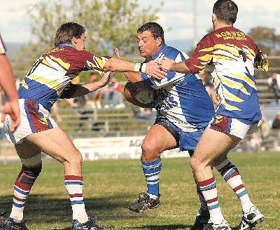 Moree coach Paul Raveneau crashes into the West Lion defence last Sunday. He’s likely to start Sunday’s grand final with John Craigie coming of the bench. Photo: Geoff O’Neill