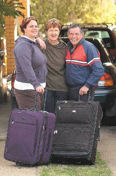 Cheering: Olympian Stacey Porter will have her family cheering for her at Athens. Here Robyn and Stan Porter with daughter Kristy, left, prepare to leave for Greece. Photo: Barry Smith
