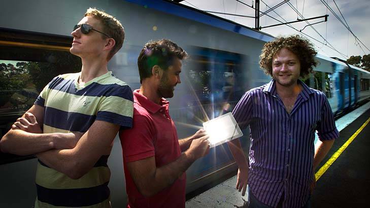 Matt Clark (left), Simon Joslin and Tom Killen, partners in The Voxel Agents studio, demonstrate their Train Conductor game at Collingwood rail station.