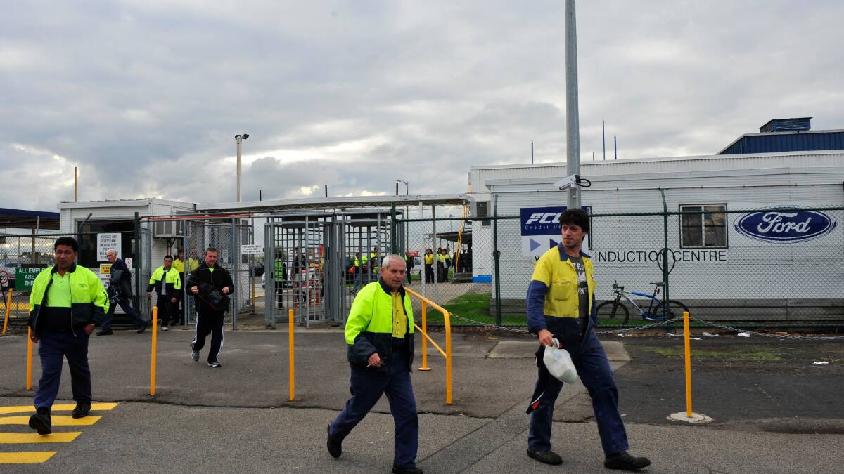 Workers leave the Broadmeadows plant in 2011 after job cuts were announced. Photo: WAYNE TAYLOR