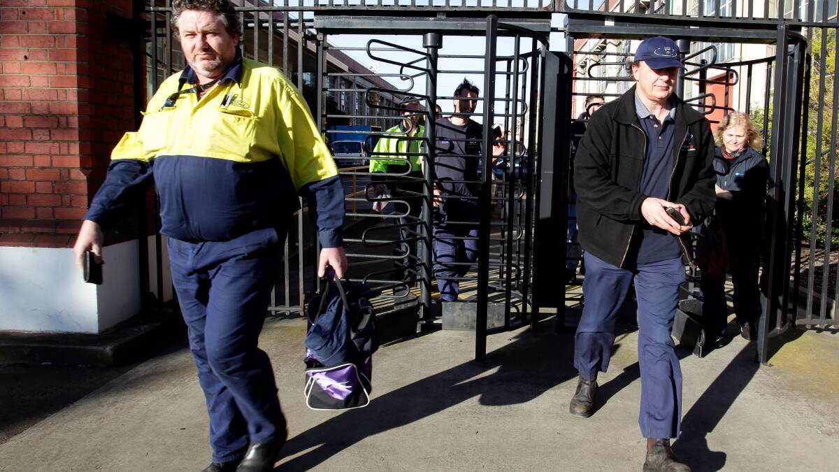 Workers leave Ford's Geelong plant after the announcement of 440 job cuts in July 2012. Photo: ANGELA WYLIE