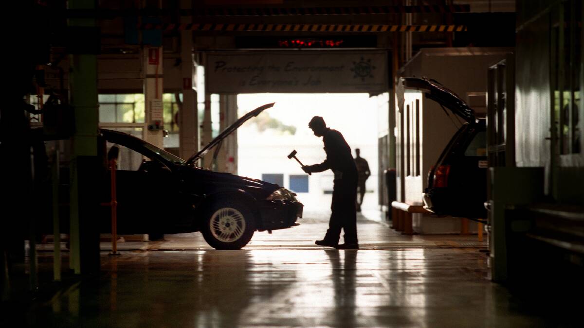 A worker completes a car at Ford's Broadmeadows plant. Photo: PAT SCALA