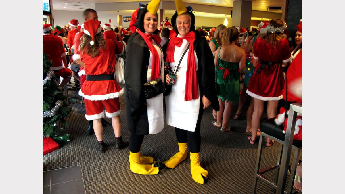 Penguins! These ladies stood out among a sea of Santas at The Post Office Hotel. Photo: Kitty Hill