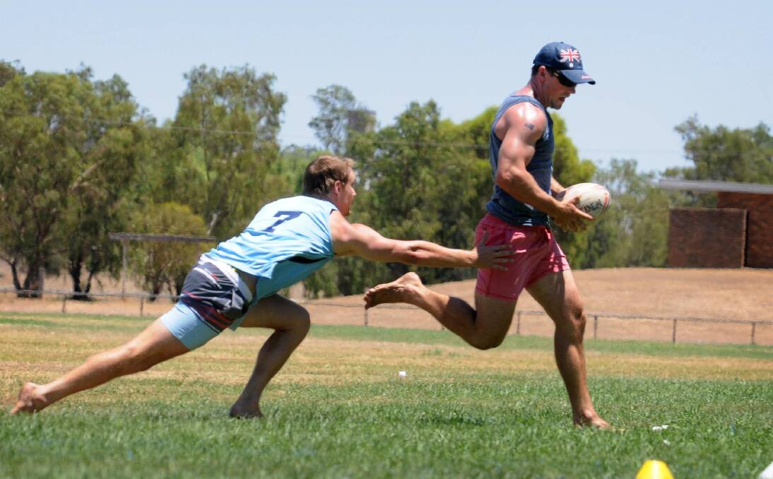 The Mitchell brothers competed against each other in the Touch Shootout. Here Cameron lunges at Scott. 