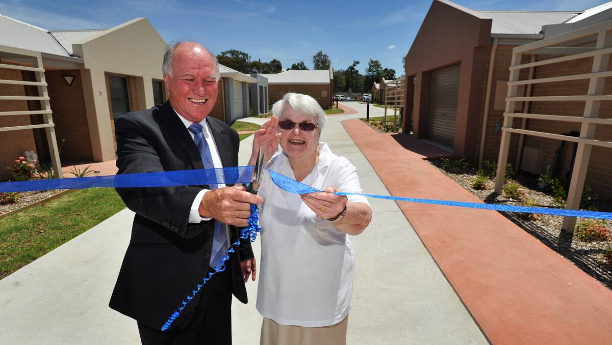 BRAND NEW: New England MP Tony Windsor and resident Marcia White open the new UnitingCare Ageing St Andrew’s Court complex. Photo: Barry Smith 151112BSD20