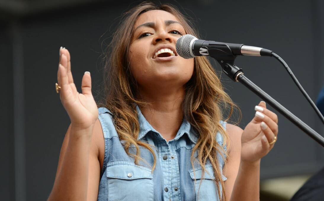 HITTING A HIGH NOTE: Jessica Mauboy takes to the microphone in a pop-up gig in Tamworth’s Bicentennial Park yesterday afternoon. Photo: Barry Smith 120114BSD27