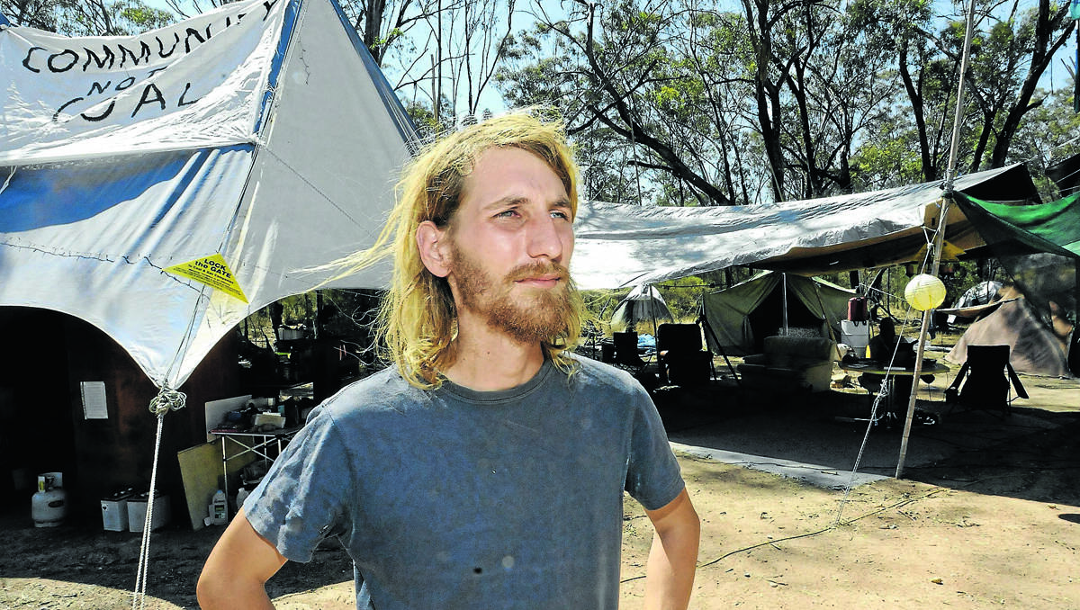 CAMP PROTESTER: Feeling the heat in more ways than one – Frontline Action On Coal protester Jonathan Moylan yesterday at the Boggabri camp. Photo: Peter Lorimer, Namoi Valley Independent