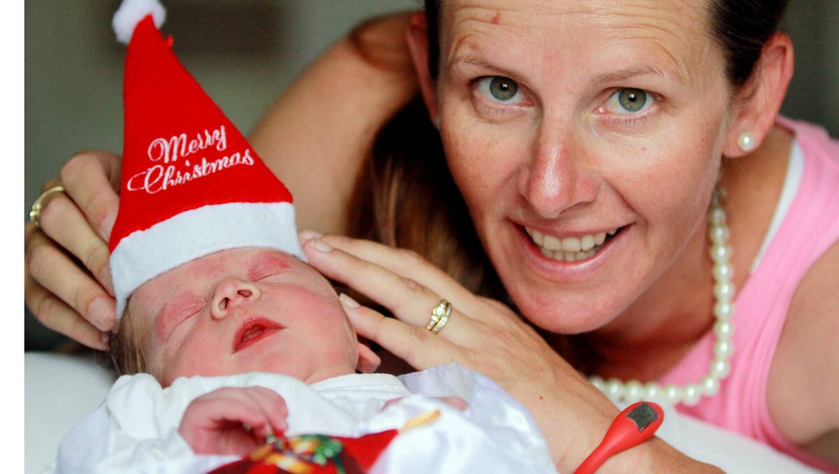 BEST PRESENT: Baby Charlie decided he’d be a Christmas Day present for mum Jacquie Henderson. Photo: Robert Chappel 261212RCC06