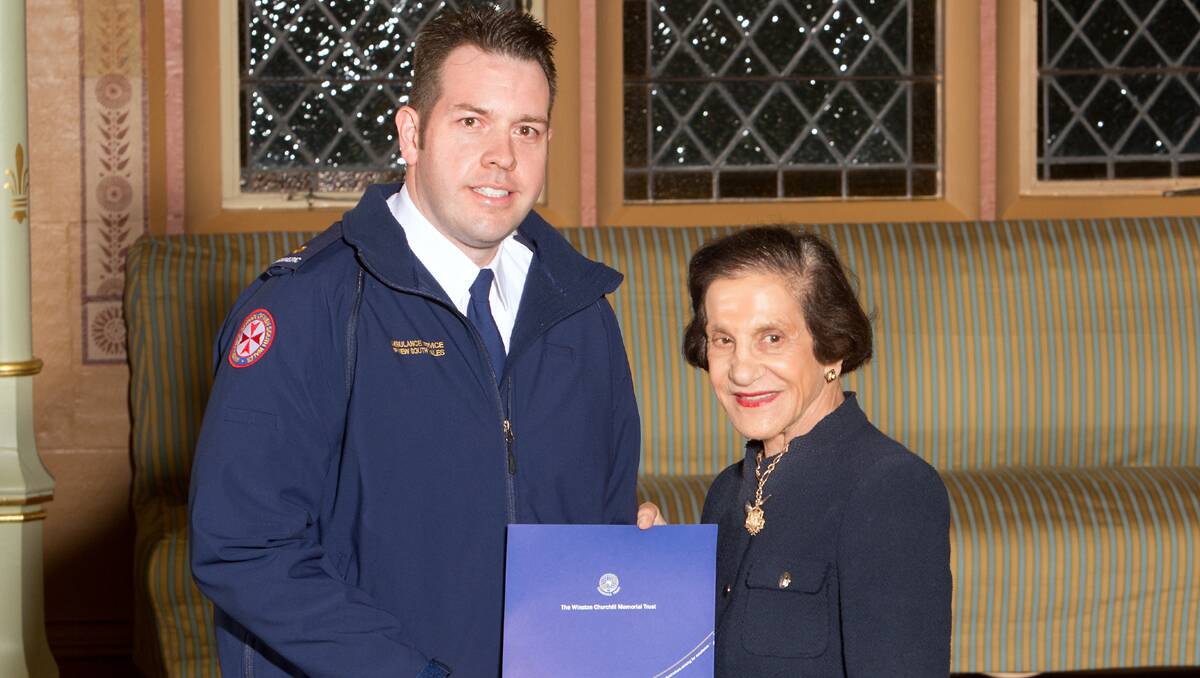 PRESTIGIOUS HONOUR: Paramedic Buck Reed receives his Churchill Fellowship from Professor Marie Bashir, the Governor of NSW. Photo: Rob Tuckwell