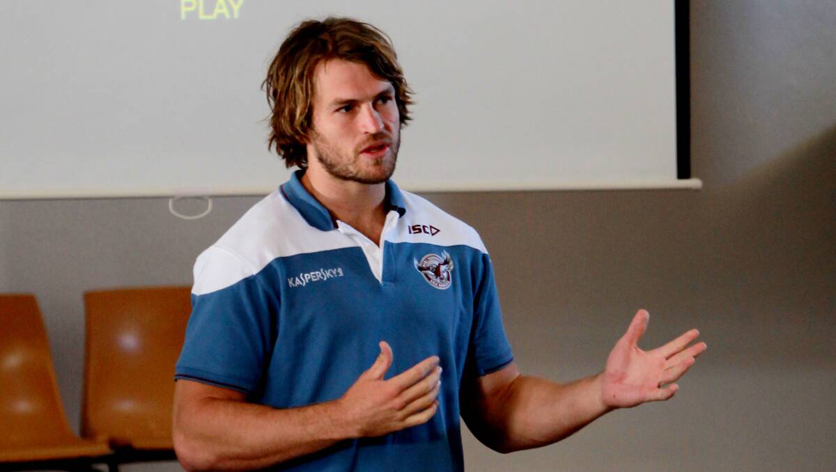 The Wolfman: Manly NRL star David Williams speaks to the kids at Bingara Central School about tackling bullying. 040213GRA03