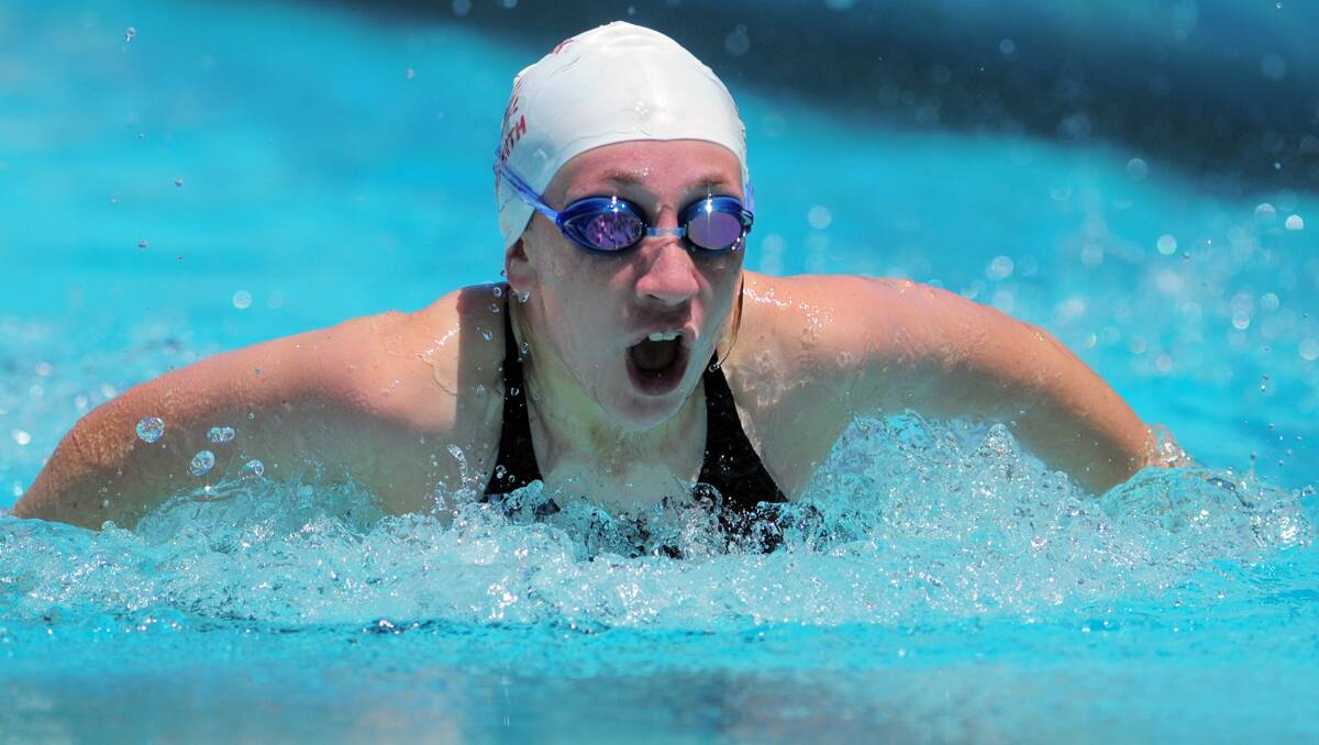 Sarah Kelly from Scully Park takes a deep breath during the girls’ 12 and Under 50m butterfly heats. 181112BSC04