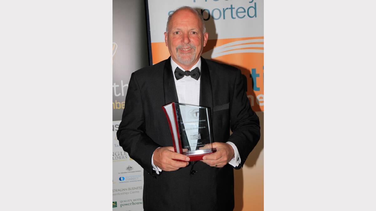 The Old Bell Tower's Lou Haslam wins the award for Excellence in Cafe Culture at the Quality Business Awards held at TRECC on Friday night. Photo: Robert Chappel