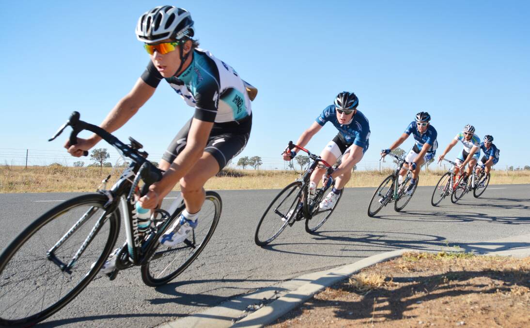 Sam Spokes leads Mick Sherwood, Fraser Ashford, Mitch Carrington and Phil Kelleher into this turn in yesterday’s Tamworth A Grade criterium at Goddard Lane in preparation for his tilt at the Herald Sun Tour on Wednesday. Photo: Barry Smith 020214BSA15
