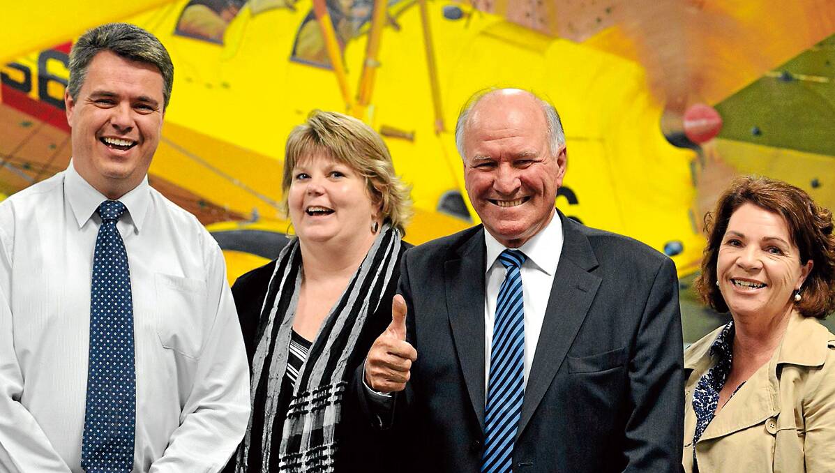 BACK IN TOWN: Leigh Tshirpg, left, Sandy York and Andra Milne were there to welcome home their boss, Tony Windsor, at Tamworth Airport yesterday. Photo: Barry Smith 280613BSC16 