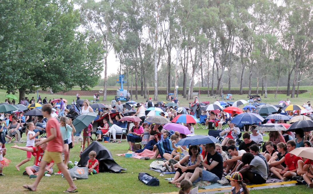 MERRY TIME: The crowd settles in for a night of singing at Carols in the Park on Saturday. Photo: Gareth Gardner 211213GGD11