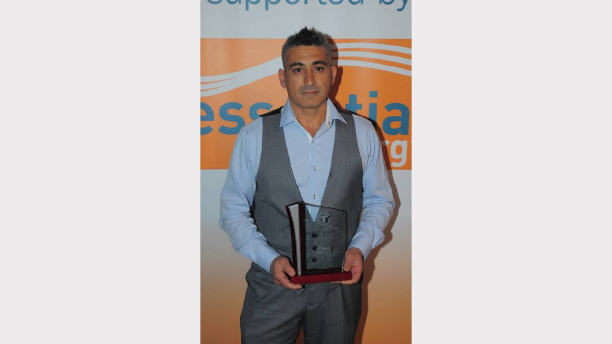 Murat Winter from Baiada accepts the award for Tamworth Business Chamber Regional Business of the Year at the Quality Business Awards held at TRECC on Friday night. Photo: Robert Chappel