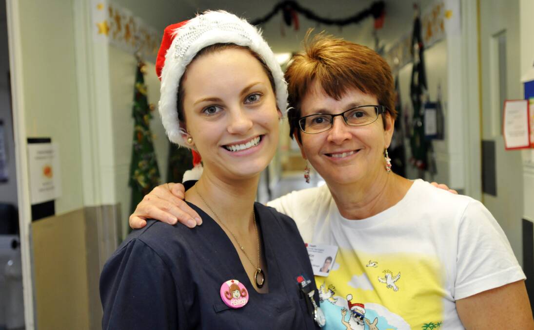 GIFT OF LIFE: Aspiring midwife Ashleigh Foy with Tamworth hospital’s clinical midwifery manager Kim Smith. Ms Foy describes Mrs Smith as ‘an inspiration’. Photo: Geoff O’Neill 241213GOA01