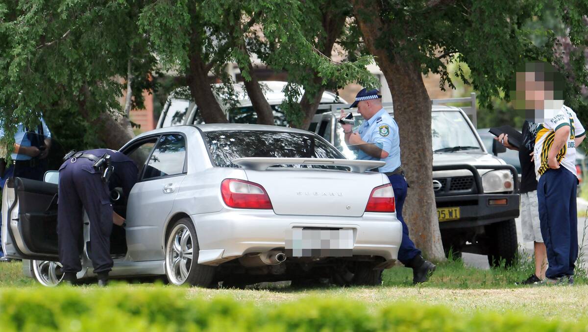 POLICE arrested three people and seized a large amount of drugs, cash and stolen property during a raid on two properties at Westdale today. Photo: Geoff O'Neill