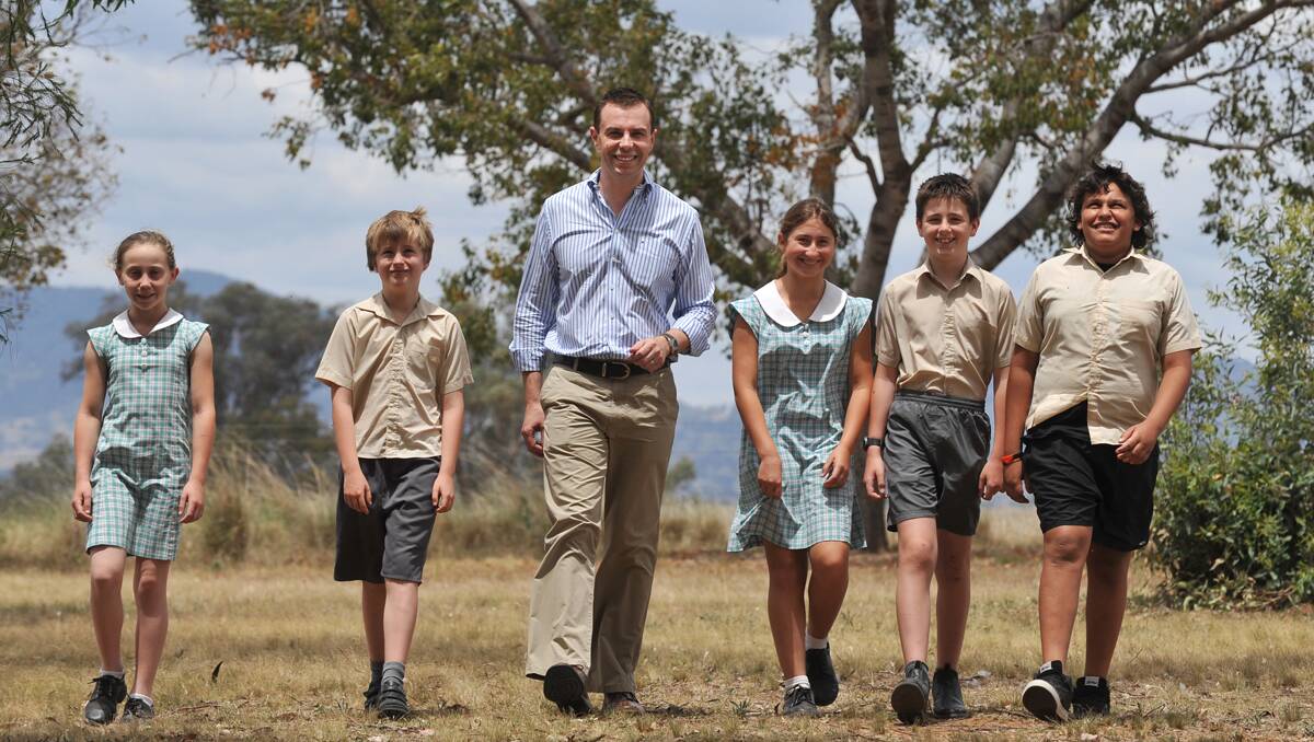 SCHOOL PROJECT: Duri Public School students Emma Ison, Thomas Hearn, Hope Taylor, Christopher McAlpine and Isaiah Blair show NSW Minerals Council chief executive officer Stephen Galilee the site of their environmental project. Photo: Barry Smith 081112BSB02