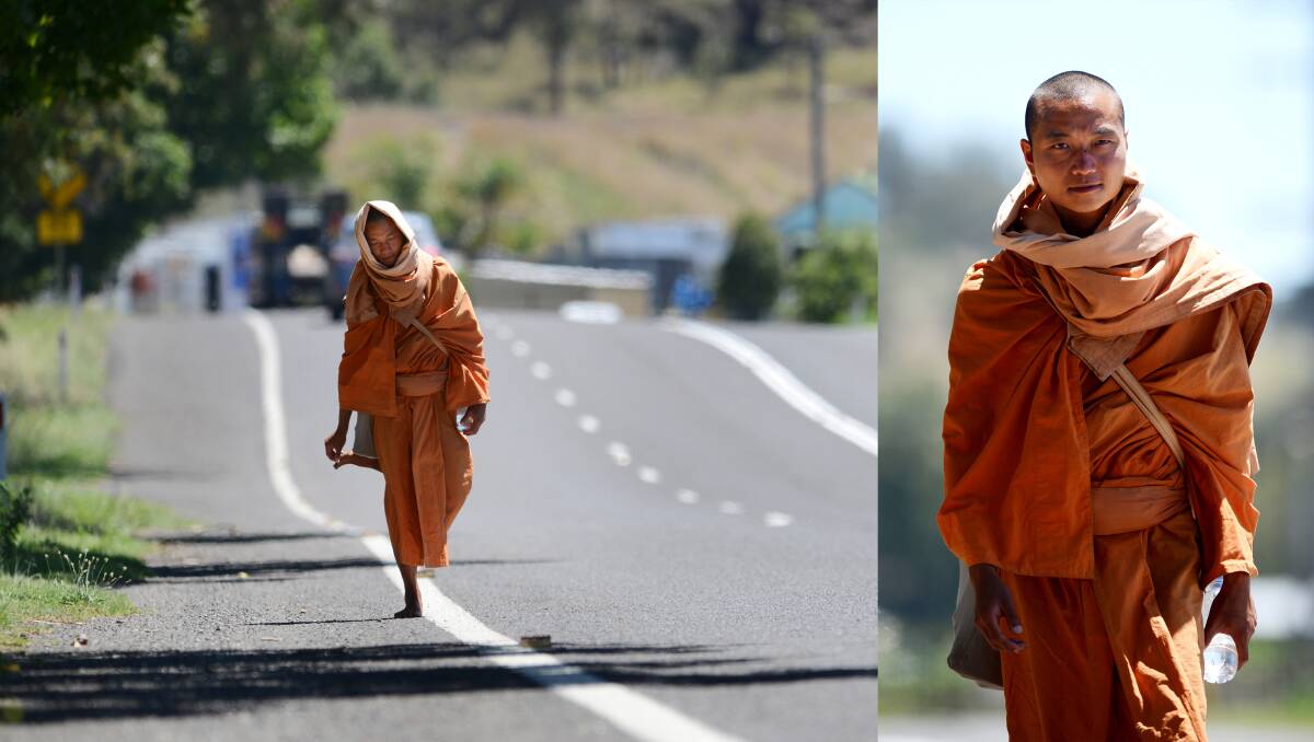 SPREADING ENLIGHTENMENT: Jinasiri or Jason Chan, a barefoot Buddist Monk walking from Queensland to Sydney, through Tamworth. Photo: Barry Smith 281113BSA03 and 16