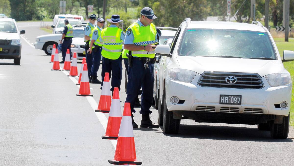 Anniversary: Officers from the Traffic and Highway Patrol Command in Sydney joined Oxley Local Area Command officers this week in random breath-testing as part of Operation Paciullo, which celebrates 30 years since breath-testing technology came into being. Photo: Robert Chappel 060313RCD02