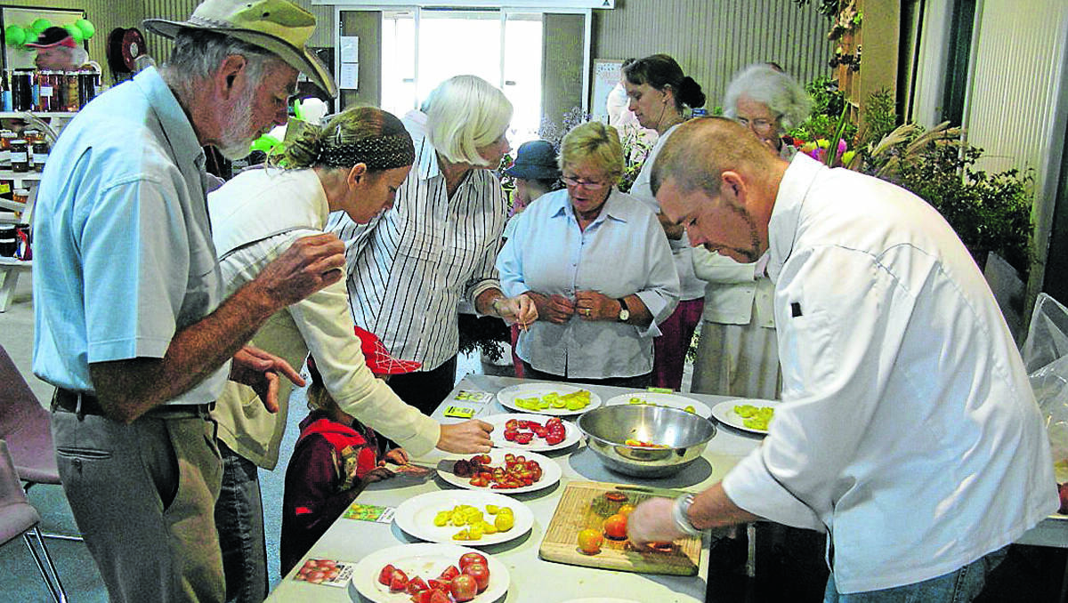 TASTE TEST: Chef Darren McDonnell presides over the popular tomato tasting event at Uralla Show this year.