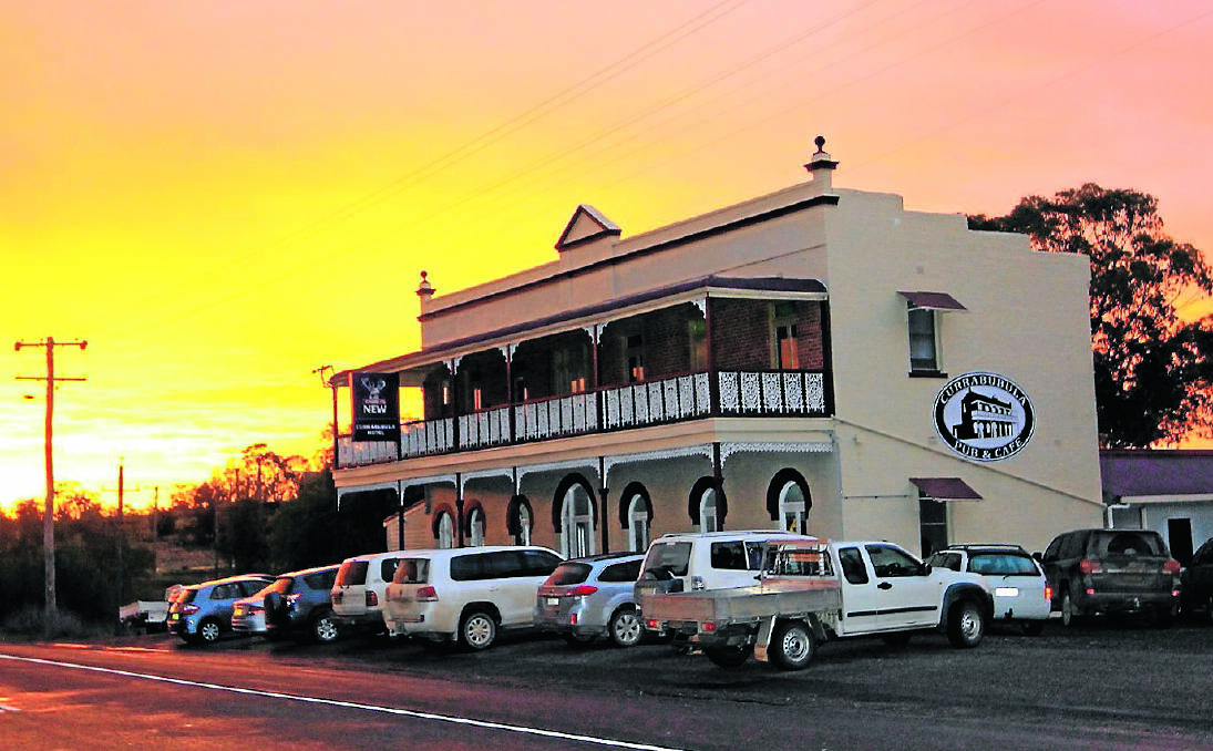 ONLY 400 METRES FROM RAIL: The sun sets as people enjoy the grand opening of Currabubula Pub and Cafe on Sunday afternoon. INSET – Licensee Cath Branson. Photo: Geoff O’Neill 031013GOD03