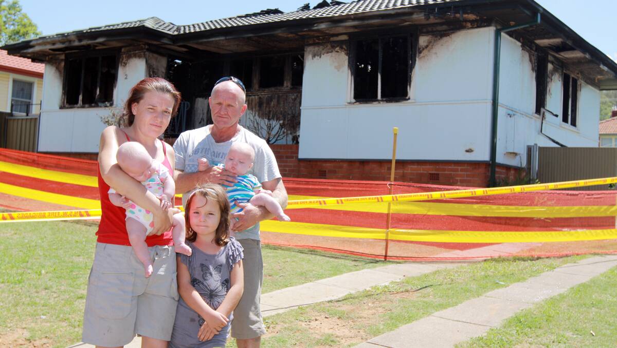 HOUSE LOST: Melanie Caldwell and Mick Manderson, pictured with their children, four-month-old twins Bella and Jarrod, and six-year-old Charlii-jene Moore, lost their Drummond Rd home and all of their possessions in a fire during the early hours of Saturday morning. Photo: Robert Chappel 090213RCA04