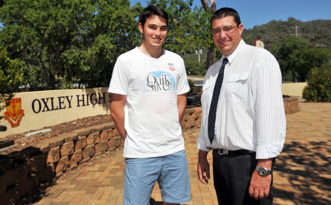 HIGH ACHIEVER: Oxley High School's Nick Stacey, pictured here with principal Simon Bartlett-Taylor, achieved an ATAR score of 97.85.  Photo: Geoff O'Neill 191213GOH01