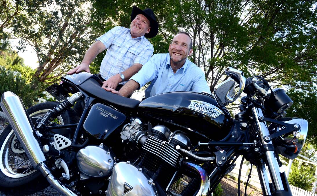NO BARRIERS: Phillip Tilley, left, with mate Paul Turner who helps him indulge his passion for motorbikes.  Photo: Barry Smith 121213BSG04