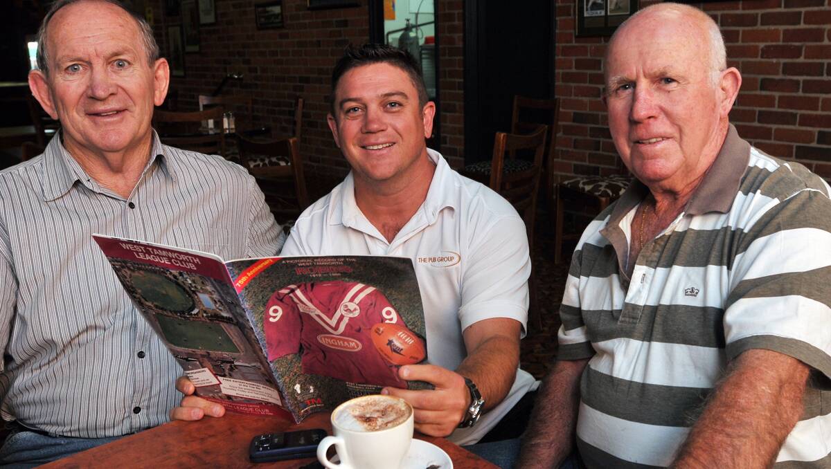 Preparing for a late West Tamworth rugby league centenary reunion (from left) former players Ken Thompson, Craig Power and Kevin Robinson look through a 75th anniversary program. Photo: Geoff O’Neill 070513GOA01