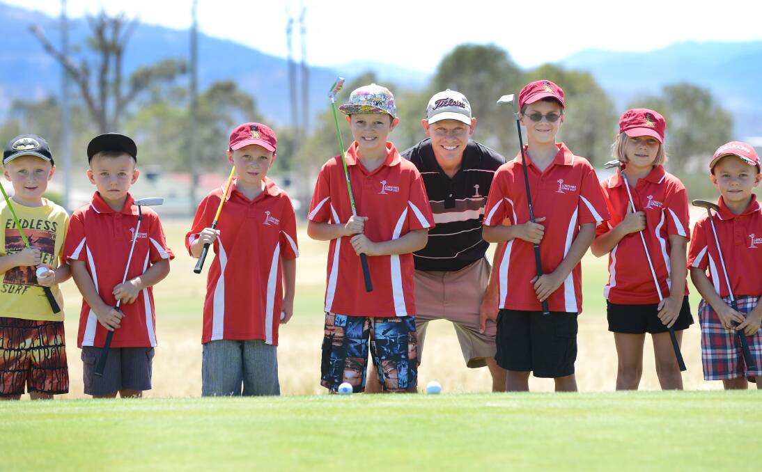 Preparing for a big golf day to raise funds for their coaching clinics are Longyard juniors (from left) Carter Russell, Willy  Costigan, Ethan Russell, Harrison Thrift, Steve Myers (Longyard golf professional), Blake Morris, Amy Morris and Charlie  Costigan.  Photo: Barry Smith 120114BSC02