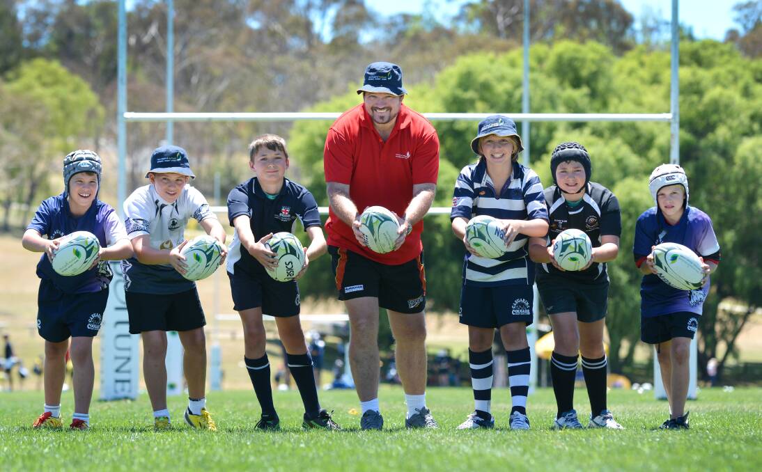 Rugby players (from left)  Cooper and  Thomas Boath, Jaedon Peters, Glen Boath, Dirk Lawrie, Ethan Peters and Adam Hollingworth have come from the other side of the country and high up north to attend this week’s National Rugby Camp in Armidale.   Photo: Barry Smith 140114BSB01