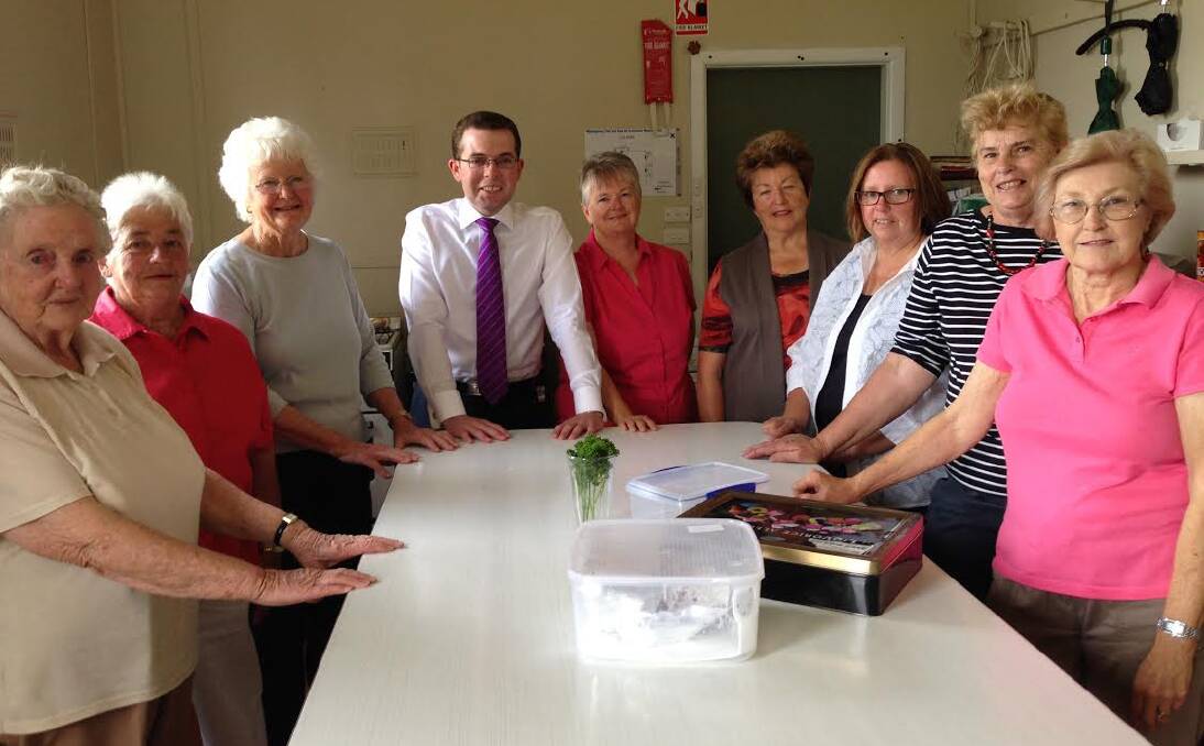 WOMEN WHO COOK: Nowendoc Ladies Auxiliary members Mary Watson, left, Margaret Higgins, Gladys Lordanic, Cheryl Margery, Gwen Higgins, Jenny Baldwin, Sue Lyon and Louise Carroll with MP Adam Marshall.