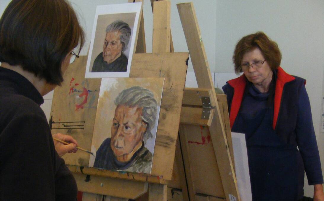 CREATIVE: Eunice Holford, left and Sue McKenzie brush up on their portrait painting skills.