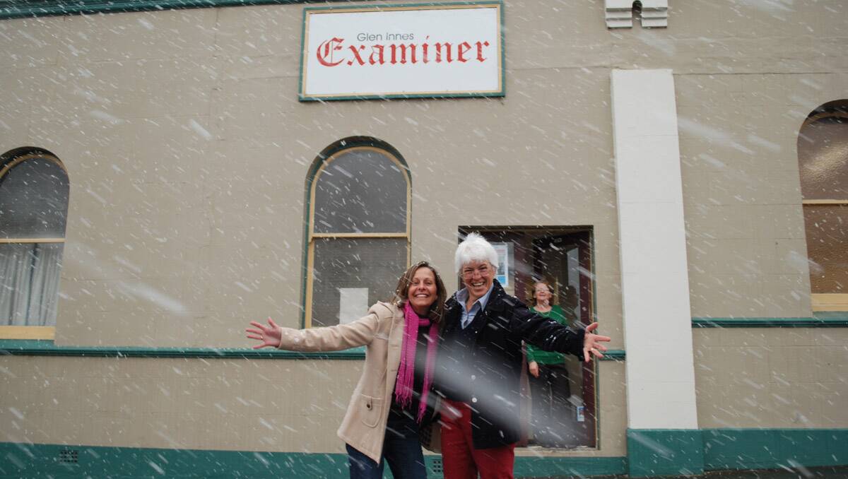 Glen Innes Examiner staff Melissa Grennan, Lisa Reed and Irene Penn enjoy the snow this morning. Photo: Glen Innes Examiner
