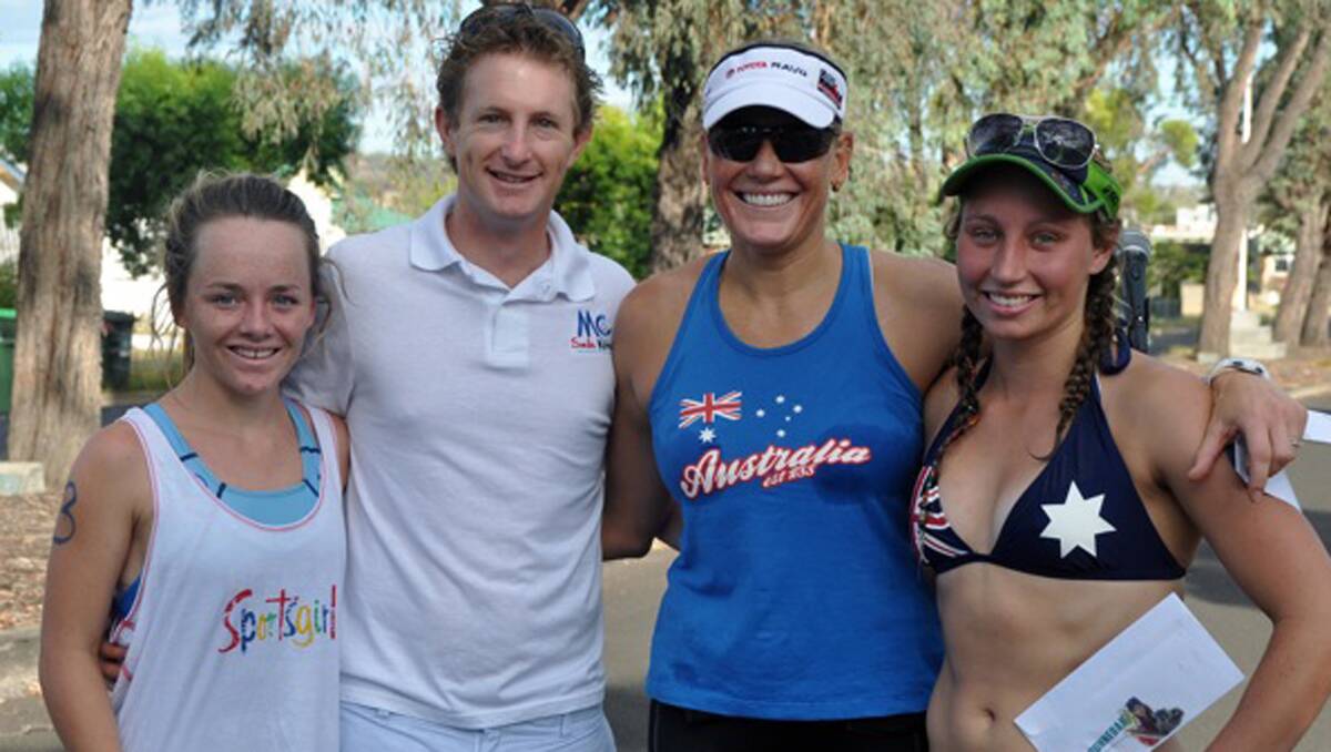 Women’s triathlon winners (from left) winner Sophie Heeney, runner-up Emily Pope, third placegetter Sarah Hickey flank Gunnedah’s Australia Day ambassador Michael Crossland.