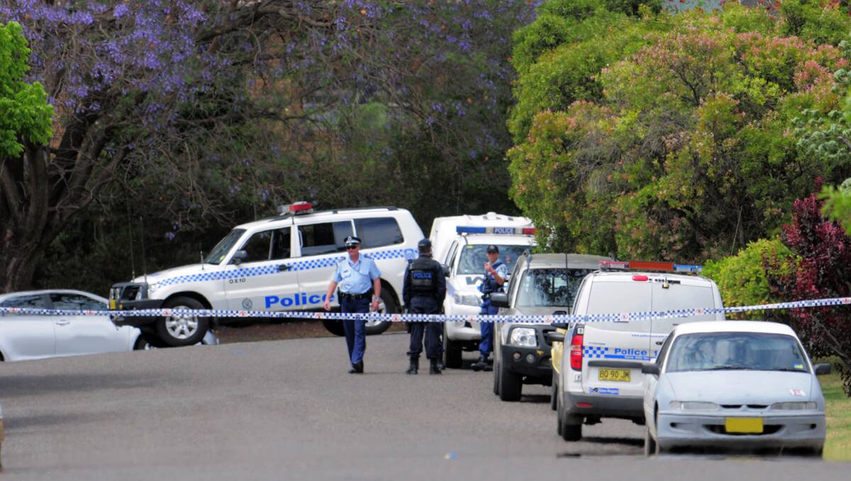CORDONED OFF: Police on the scene in Ernest St, Oxley Vale, yesterday.   Photo: Barry Smith  071112BSG03