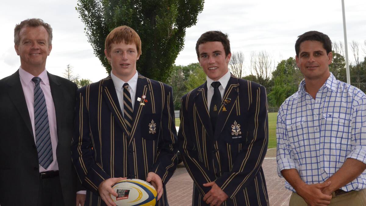 Headmaster Murray Guest (left) and TAS Old Boy and former Wallaby Sam Payne (right) discuss the TAS/ARU partnership agreement with rugby captain Will Frost (second from left) and Junior Gold squad member Charlie Scott. Photo: courtesy Armidale Express
